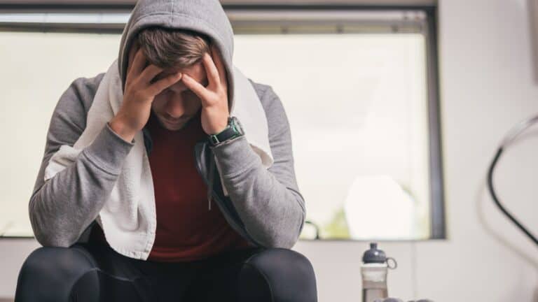 man upset after workout at the gym