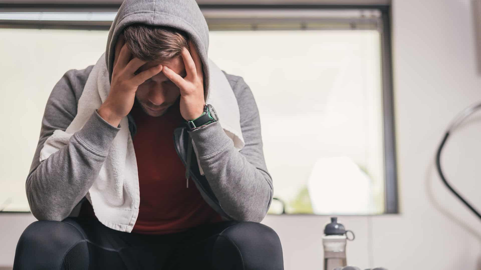 man upset after workout at the gym