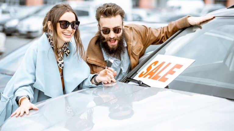 Couple buy used car.
