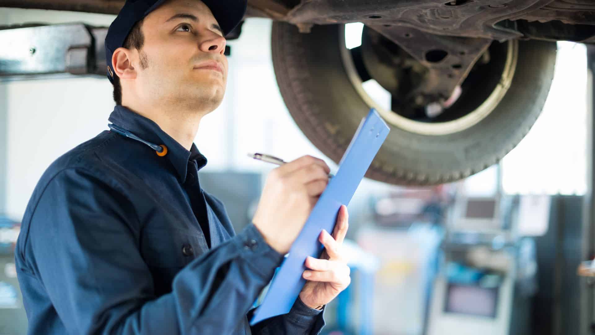 Mechanic checking car
