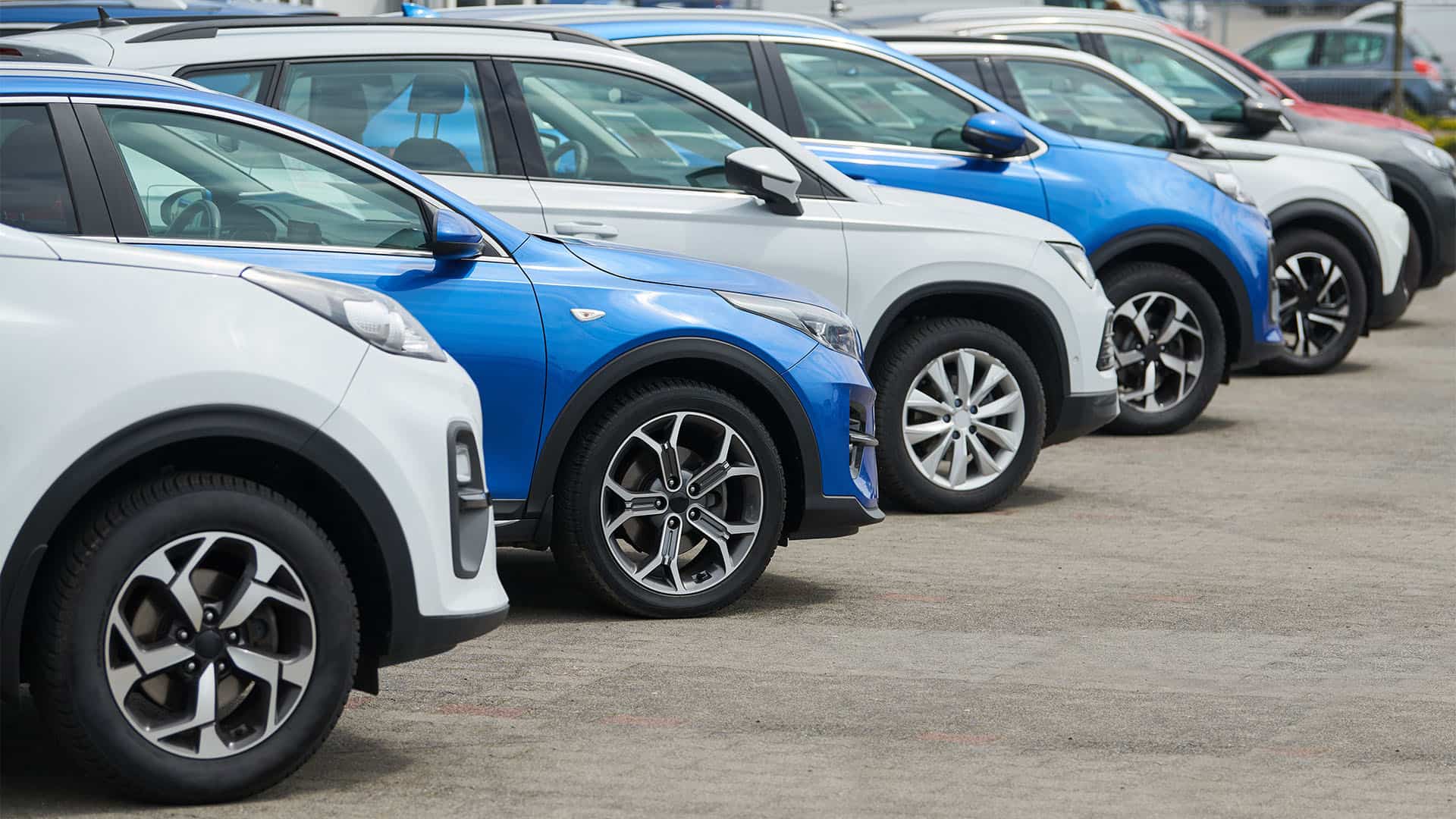 cars at dealership parking lot