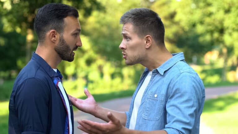 men arguing outdoor.