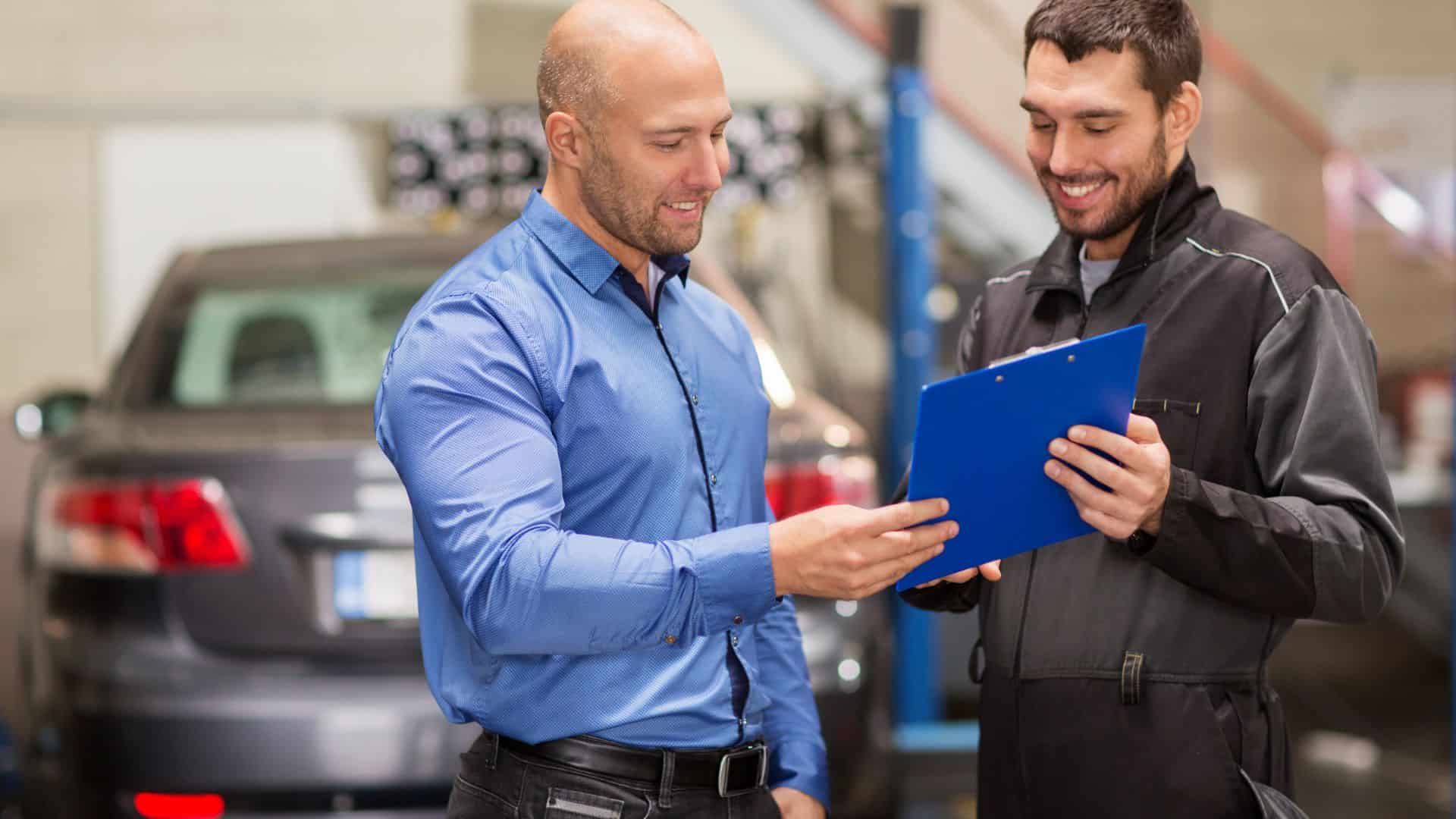 The mechanic is talking to the salesman.