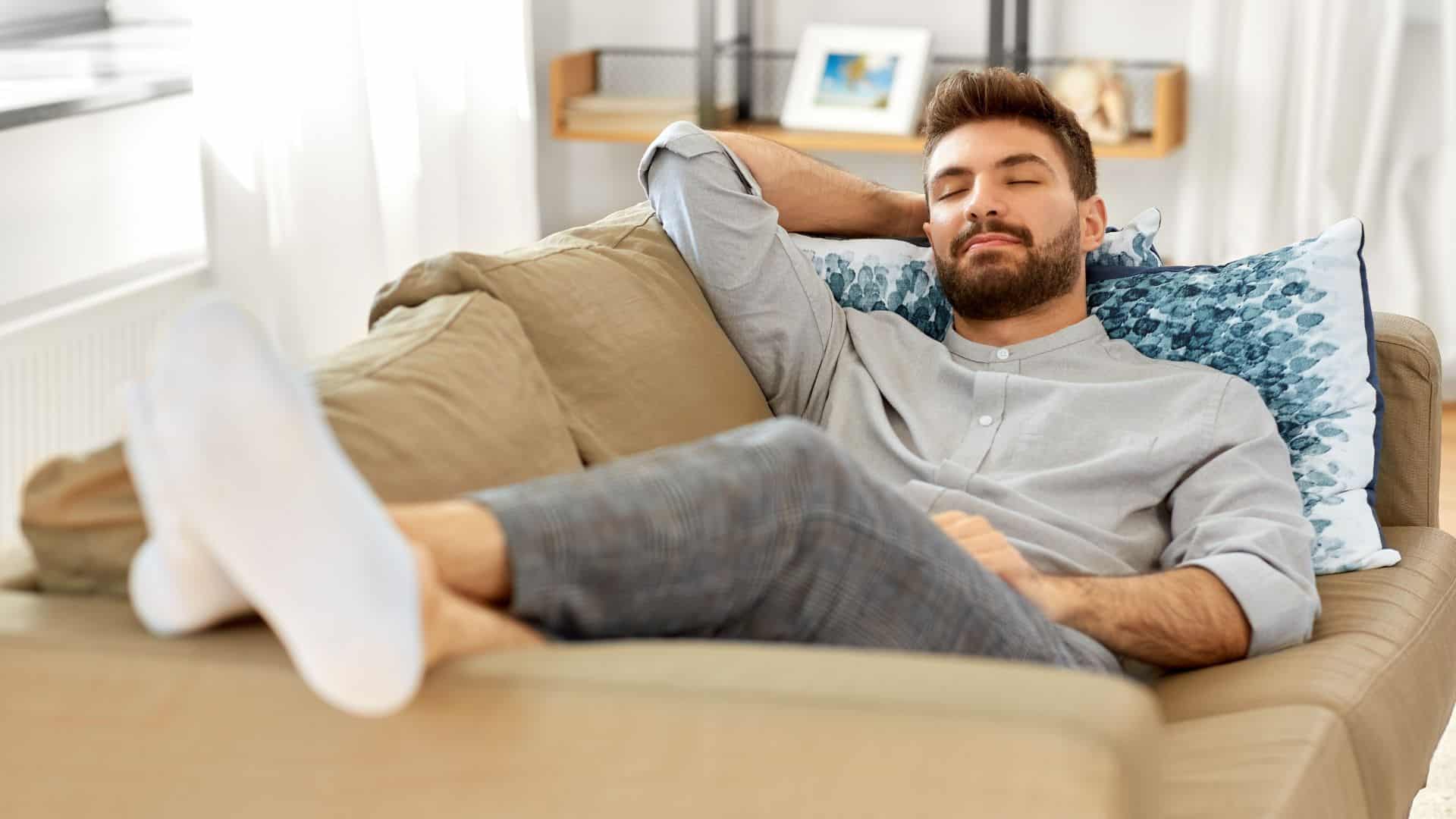 Man relaxing on couch at home