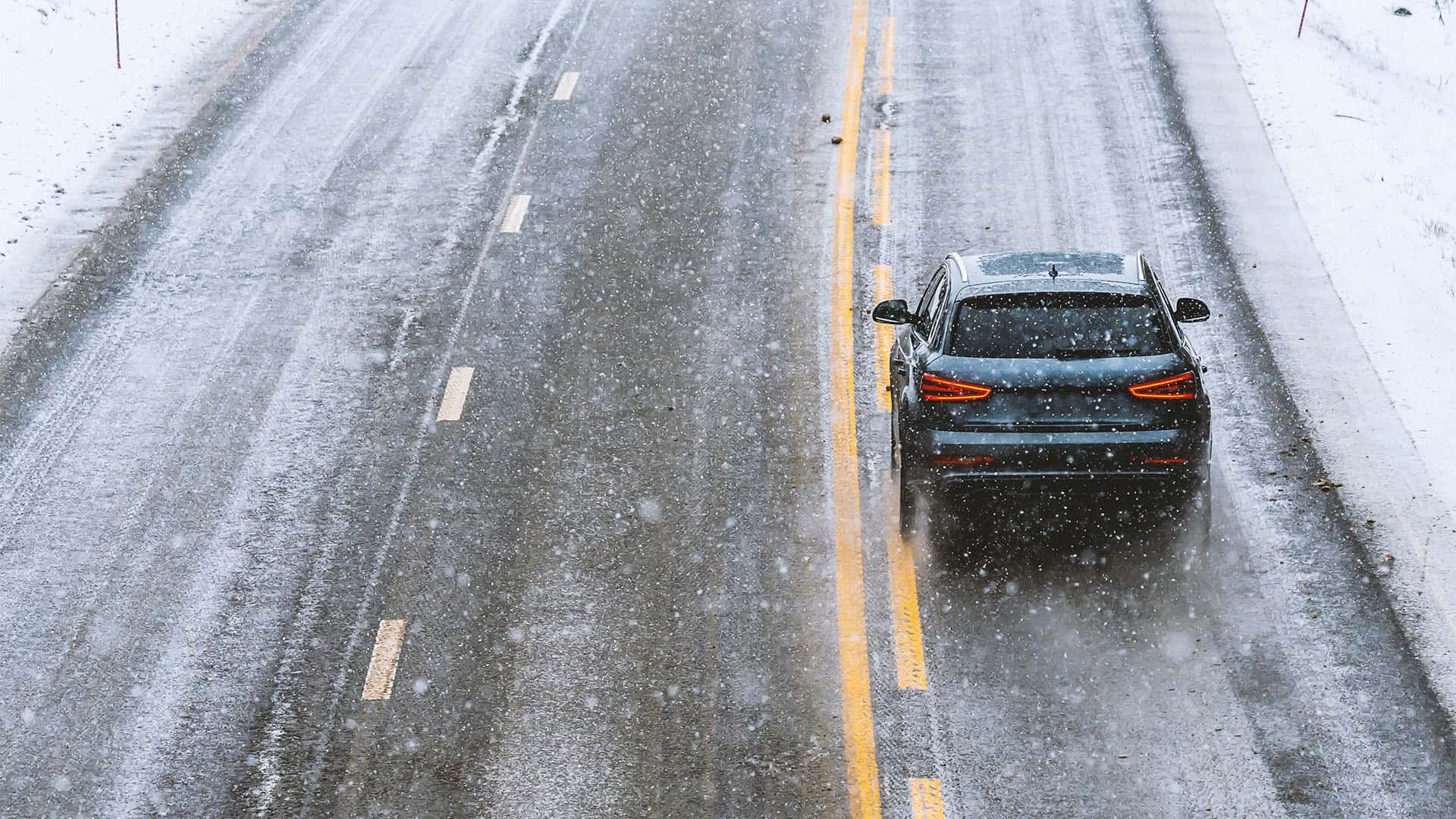 Car driving in snow.