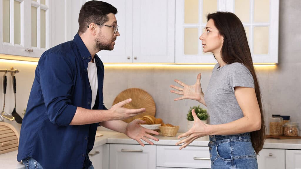 Couple argue in kitchen