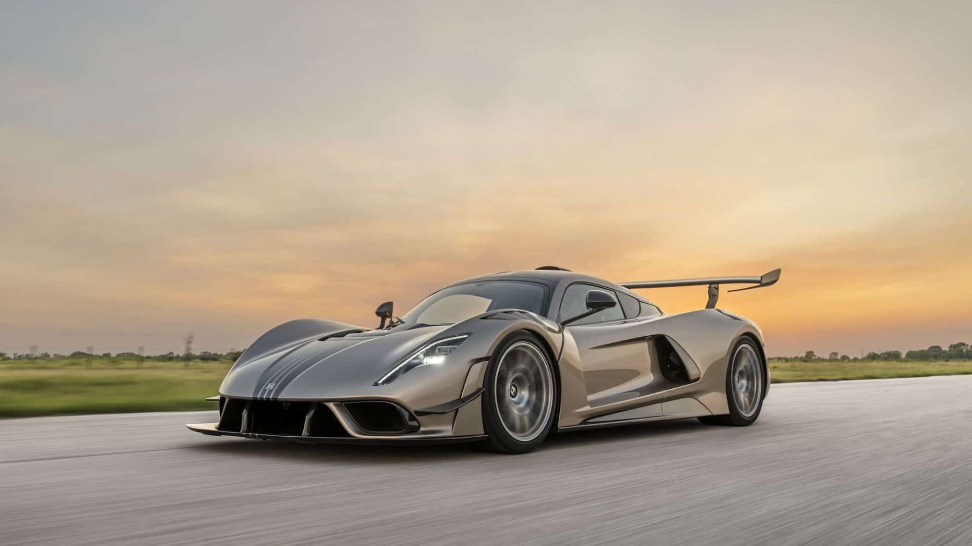 Action shot of a Hennessey Venom F5 driving down the road