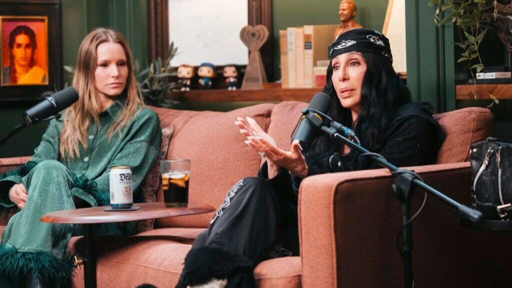 Cher speaking next to bell