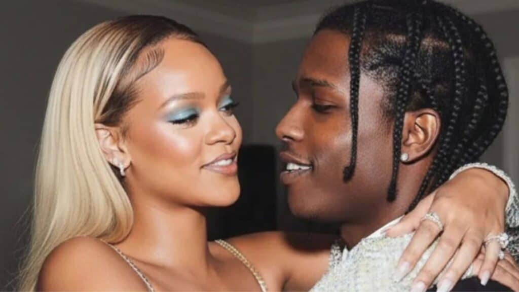 Rihanna and A$AP Rocky embracing one another at a Gala party
