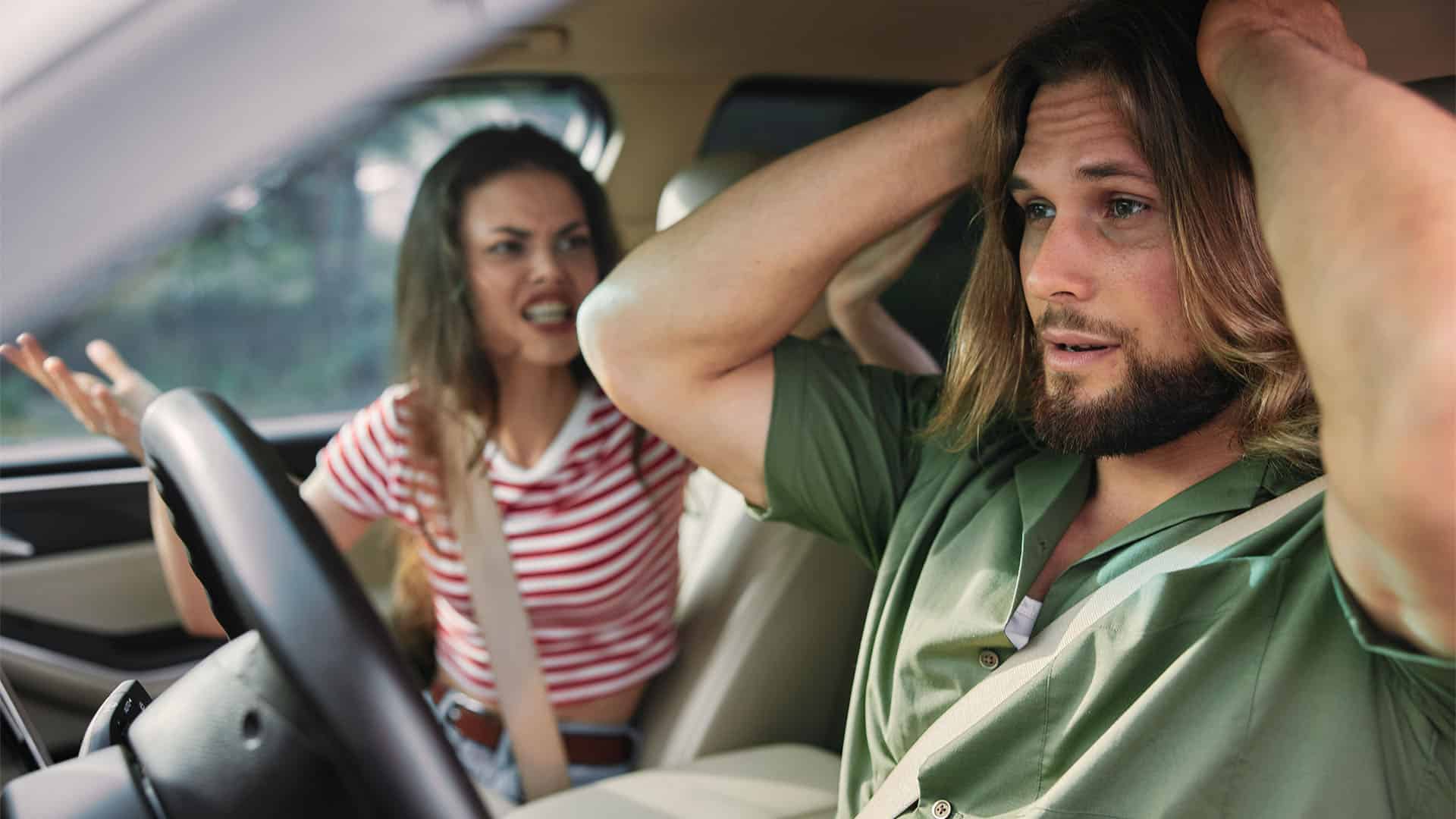 Couple argue in a car.