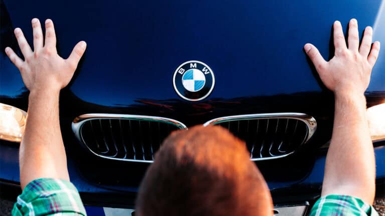 Holding hands on a BMW.