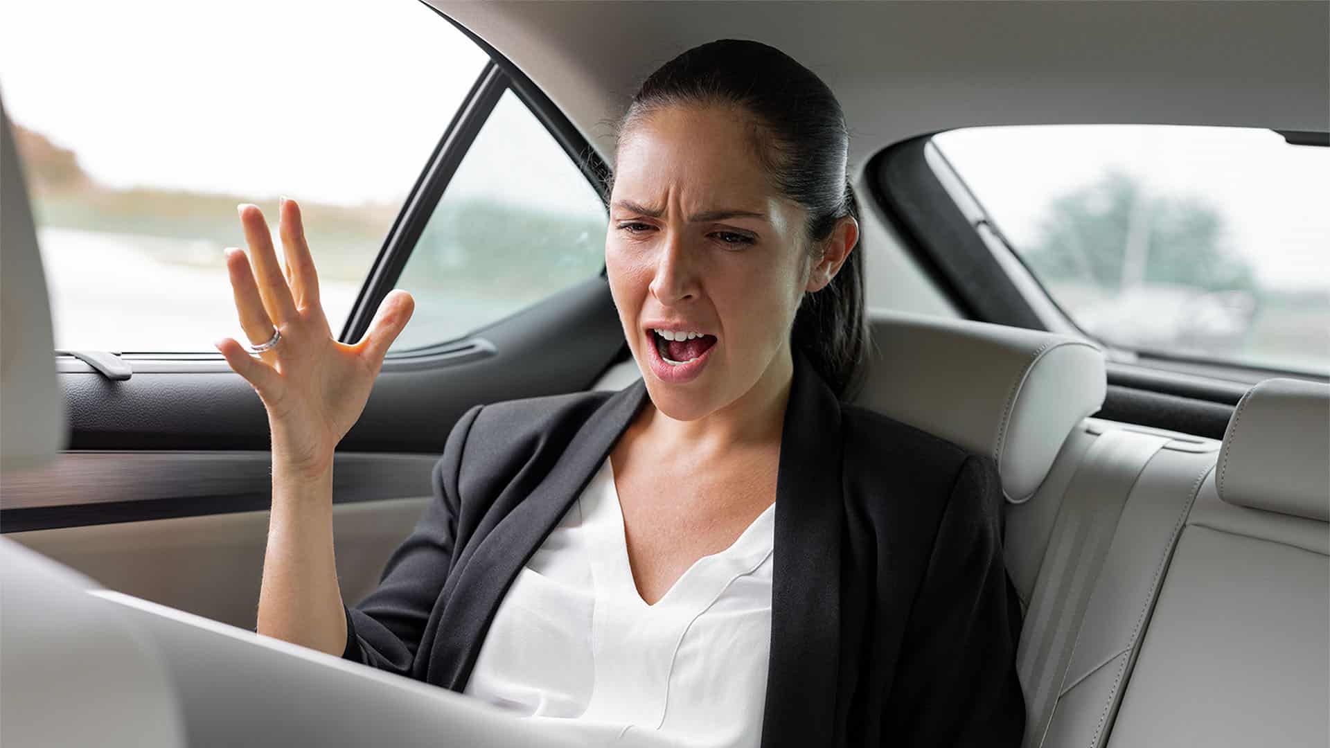 angry woman on a backseat.