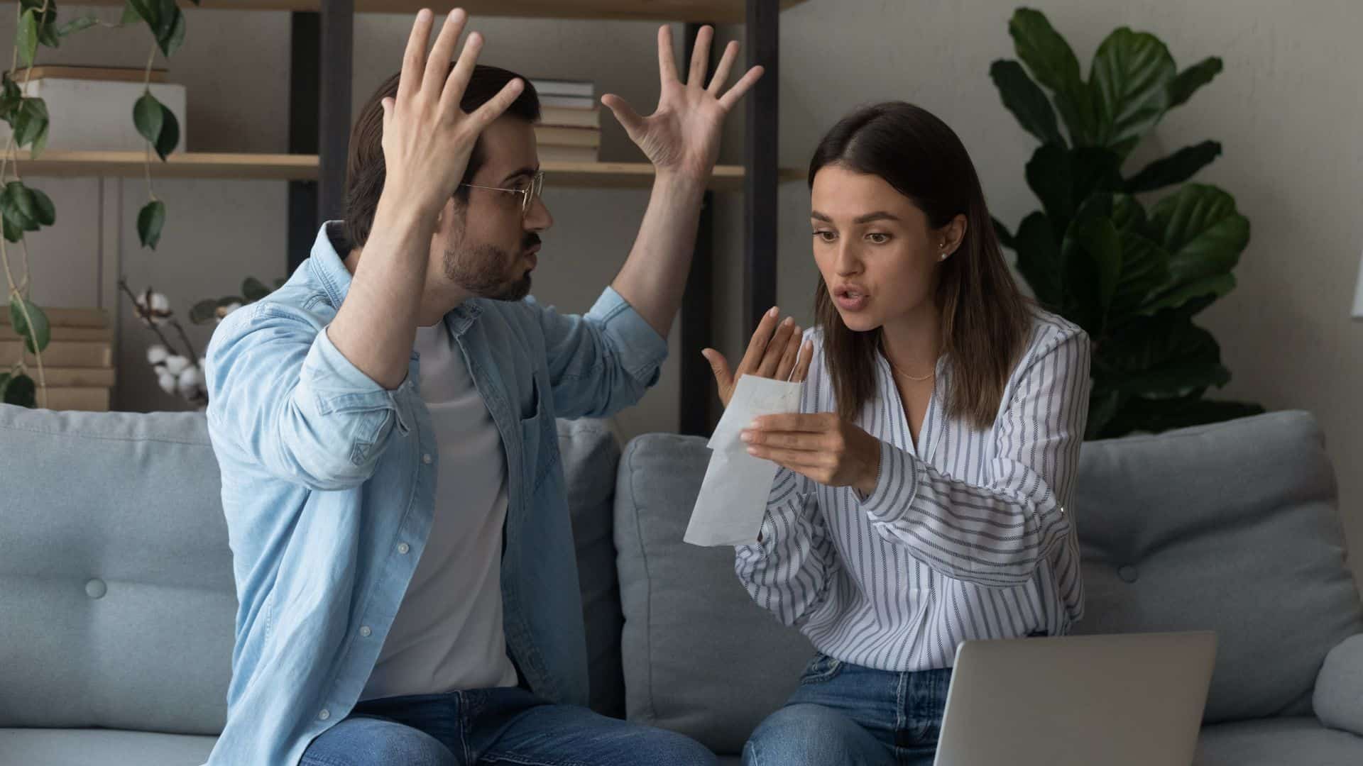 couple arguing while woman is holding a receipt