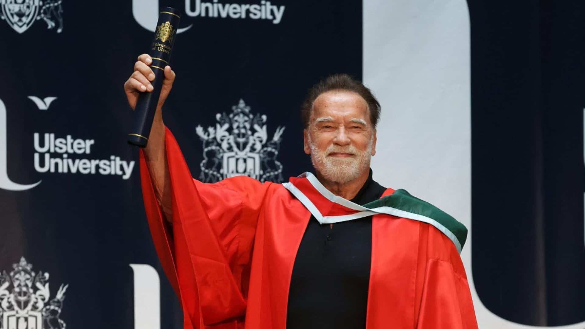 Arnold Schwarzenegger holding his honorary degree