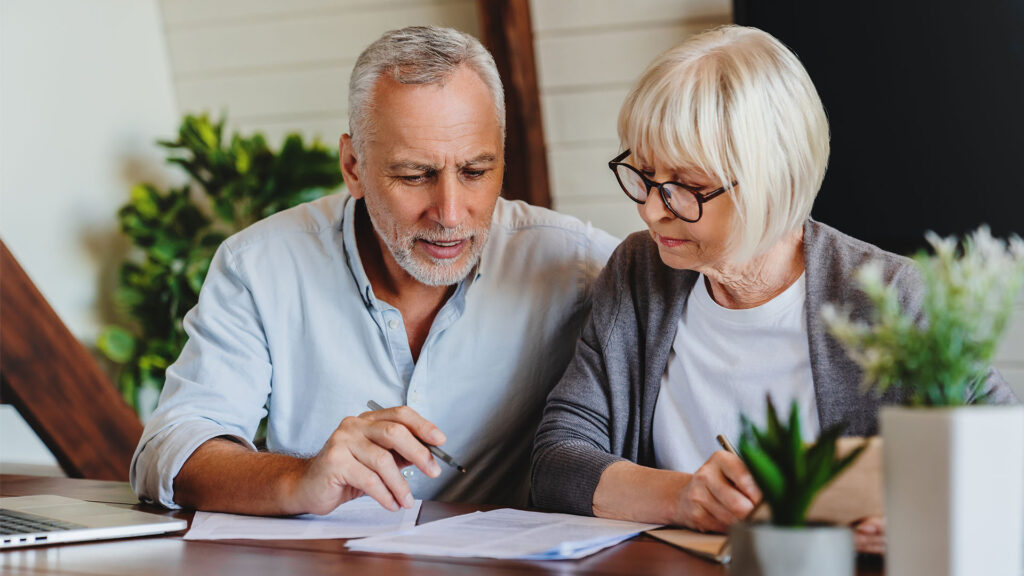 A couple reading documents.