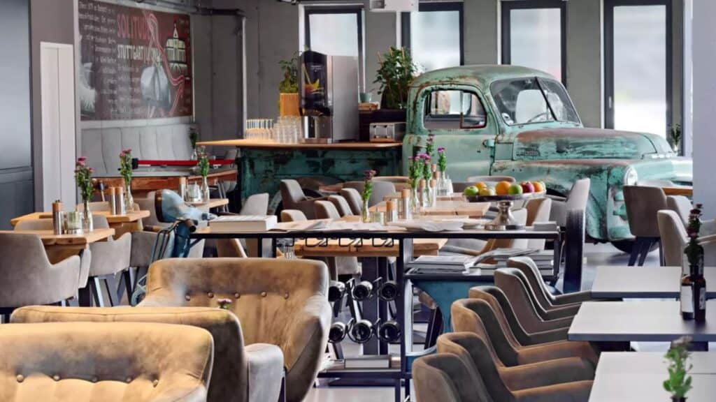 Dining at V8 hotel with table setting and car