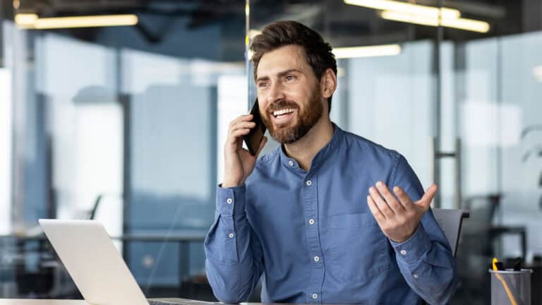 Man on a phone in office.