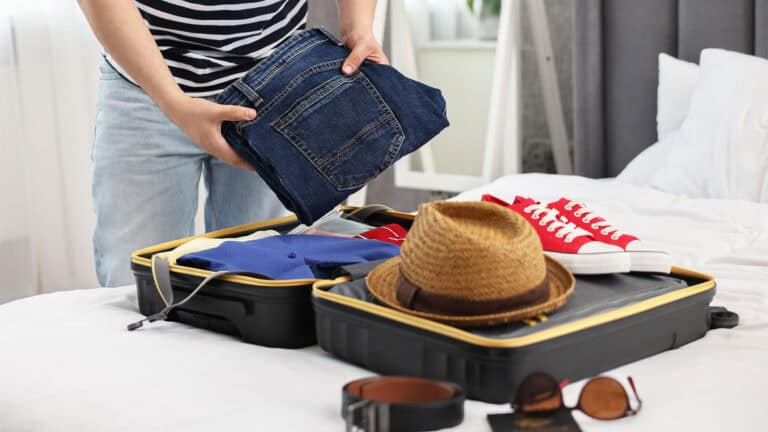 Man packing for travel.