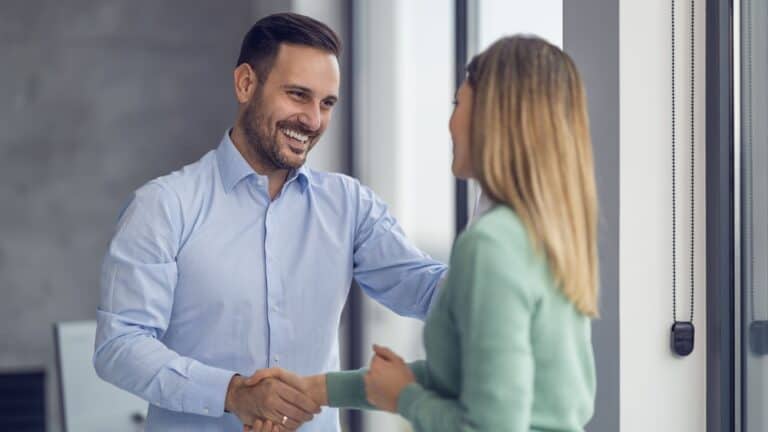 Man shaking hand with a woman
