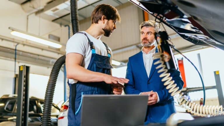 Man talking with the car mechanic