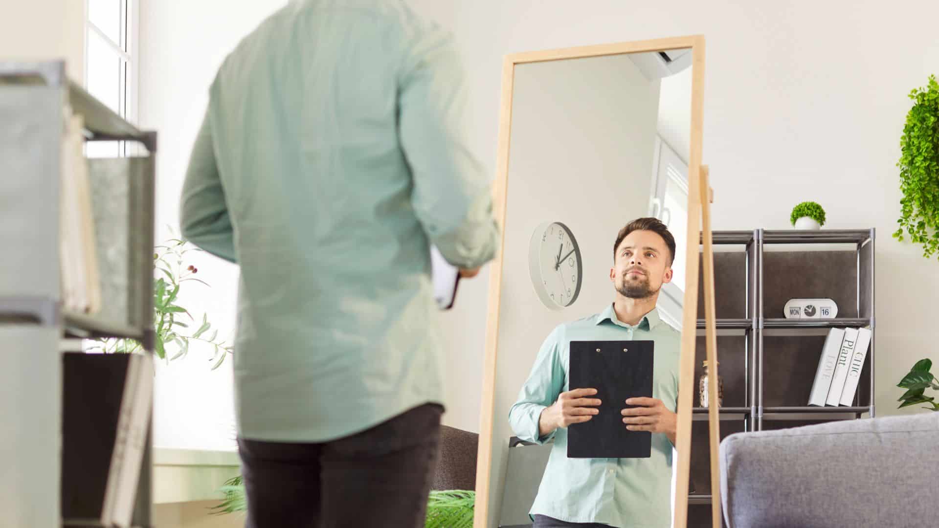 Professional man rehearses in front of mirror