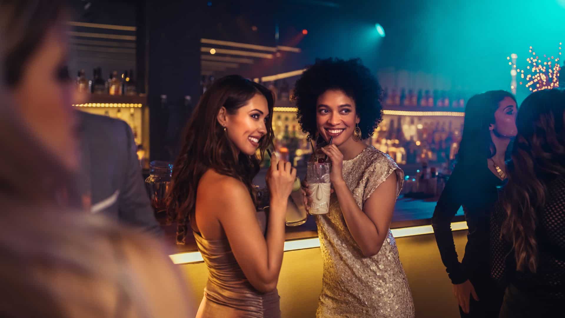 Two women enjoying cocktails