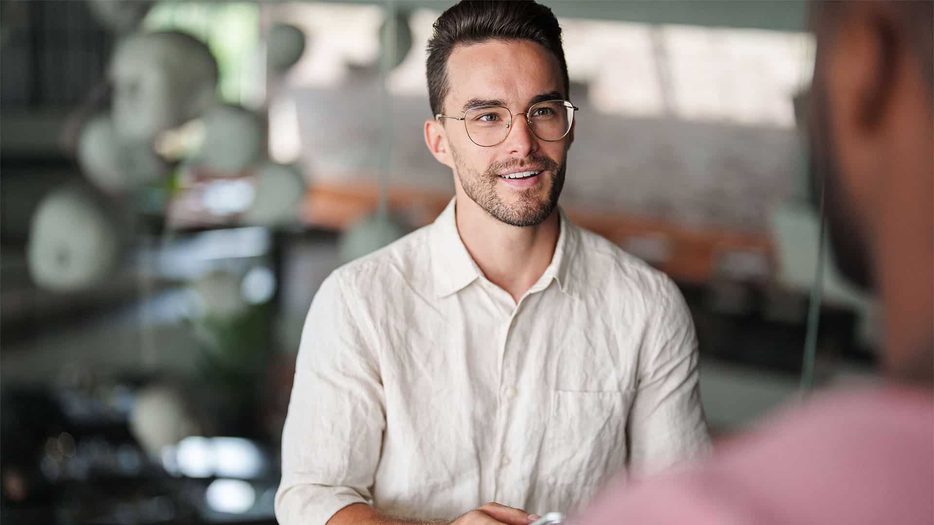 A young man talking to someone.
