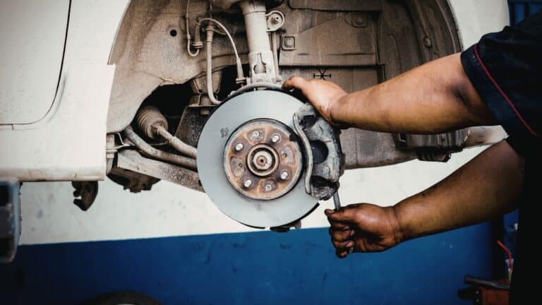 Mechanic working on Electric Vehicle brakes