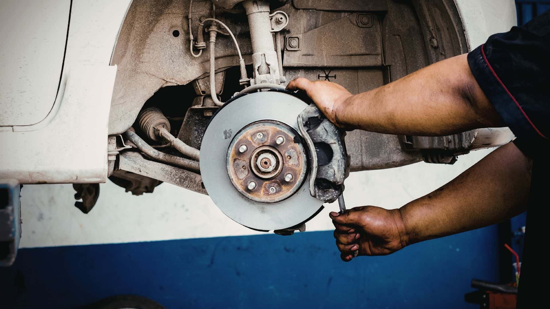 Mechanic working on Electric Vehicle brakes 