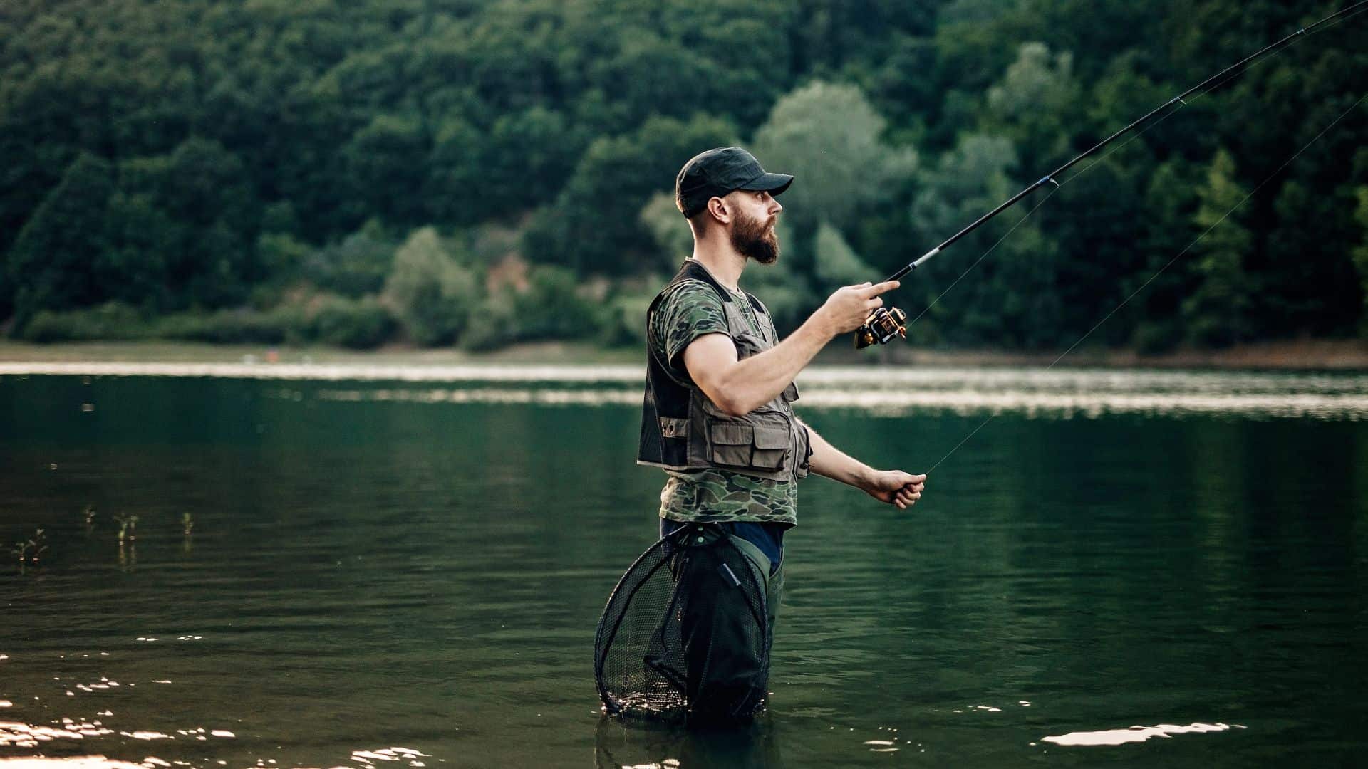 A man in waders fly fishing