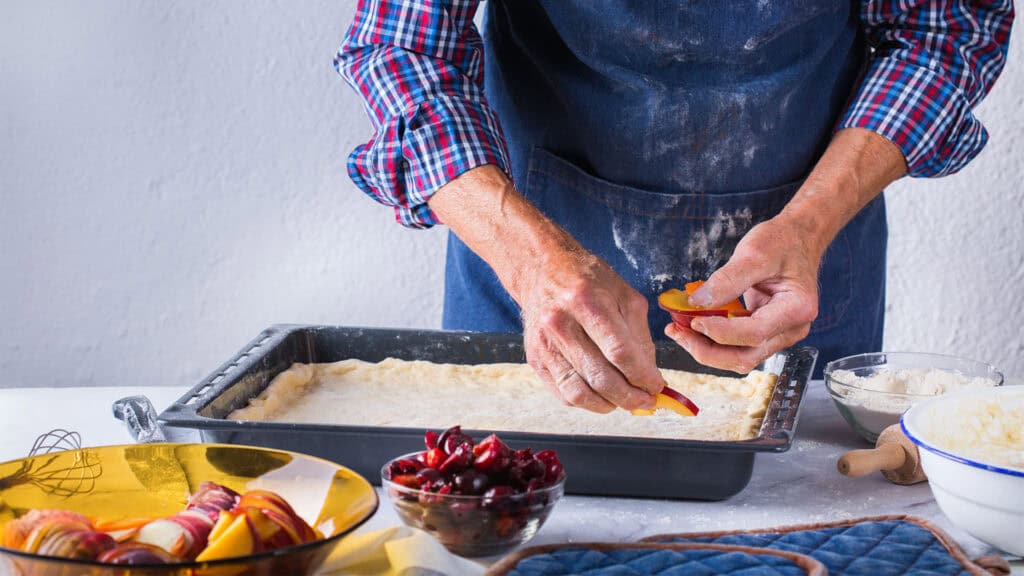 a man baking a cake