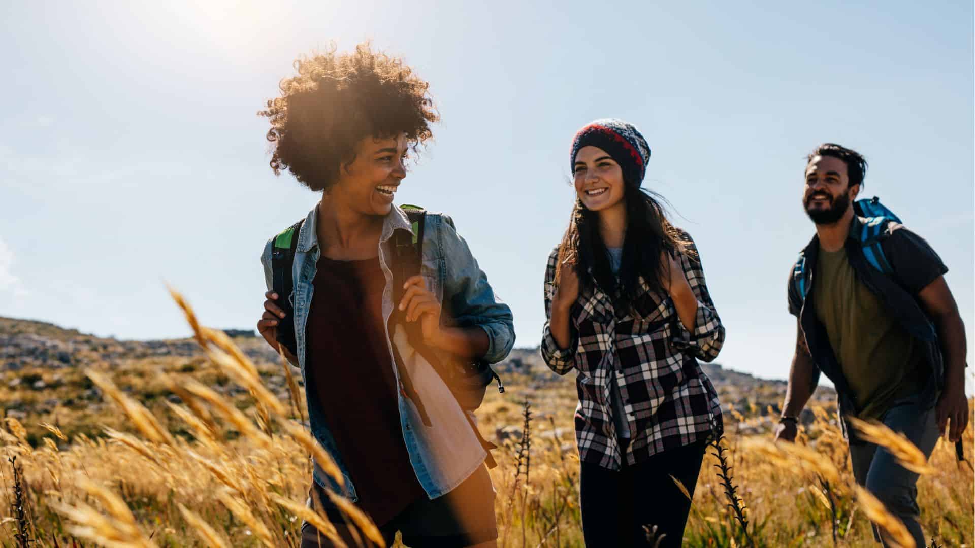 A man and two women hiking