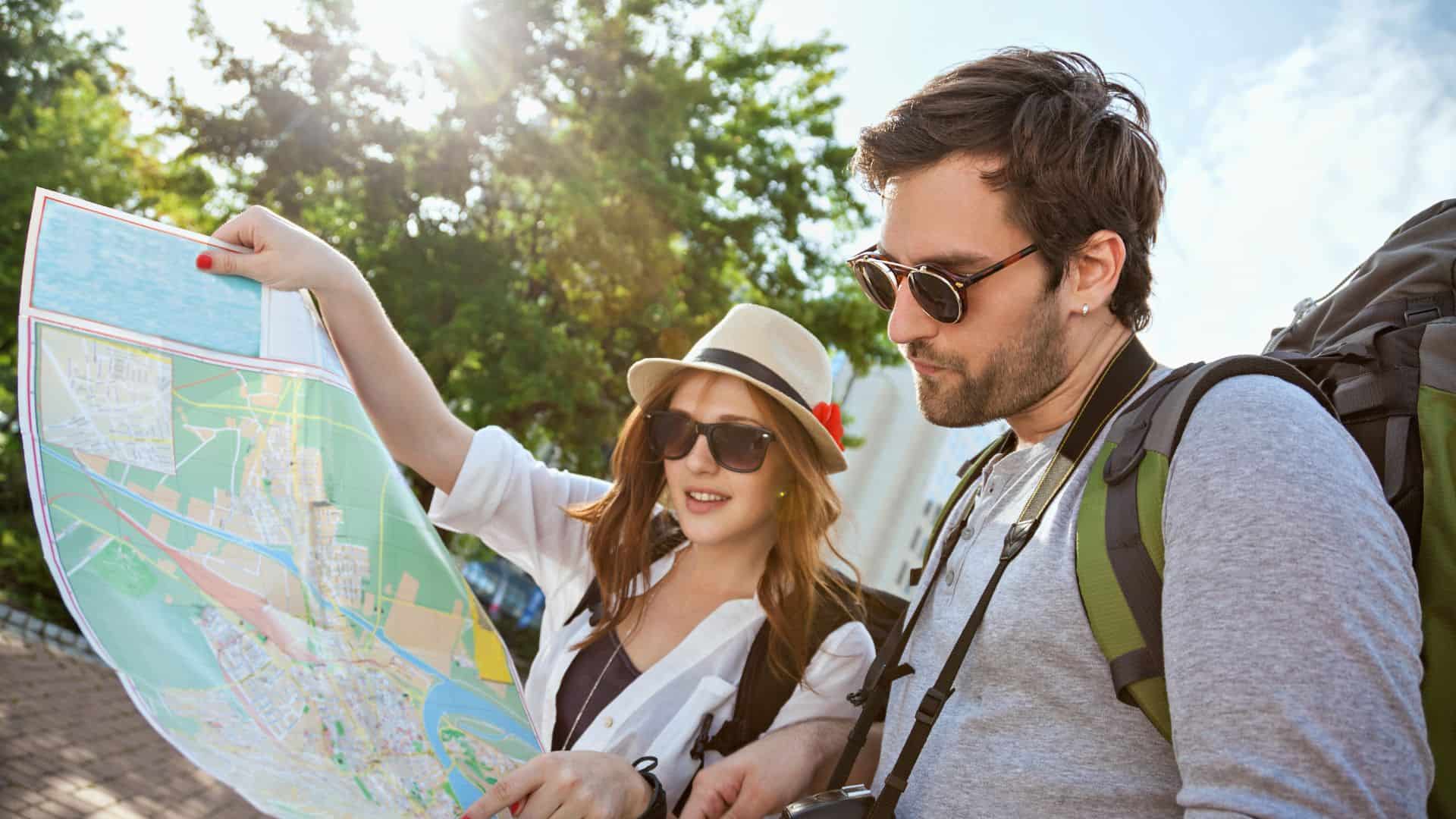 A man and his wife looking at a map