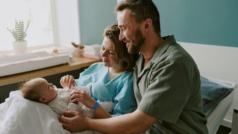 newborn at hospital with family
