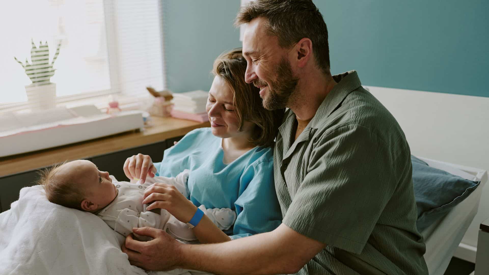 newborn at hospital with family