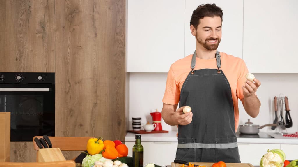 young man cooking in the kitchen