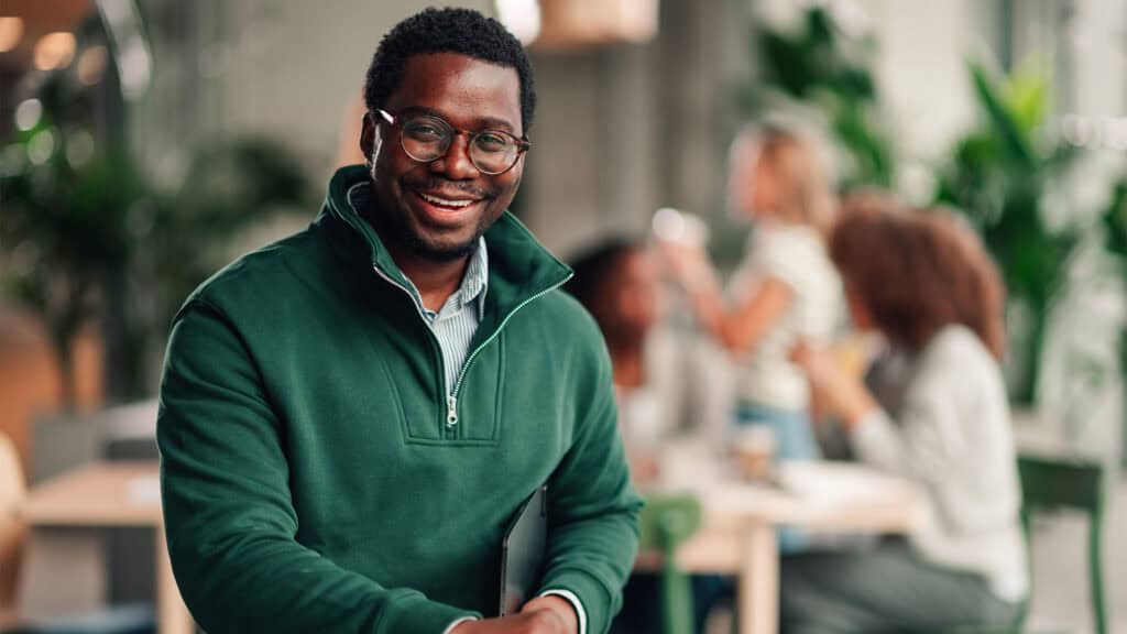Happy young man in the office