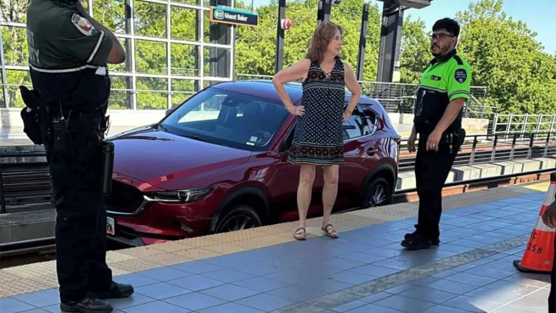 Woman droves car on a railway tracks