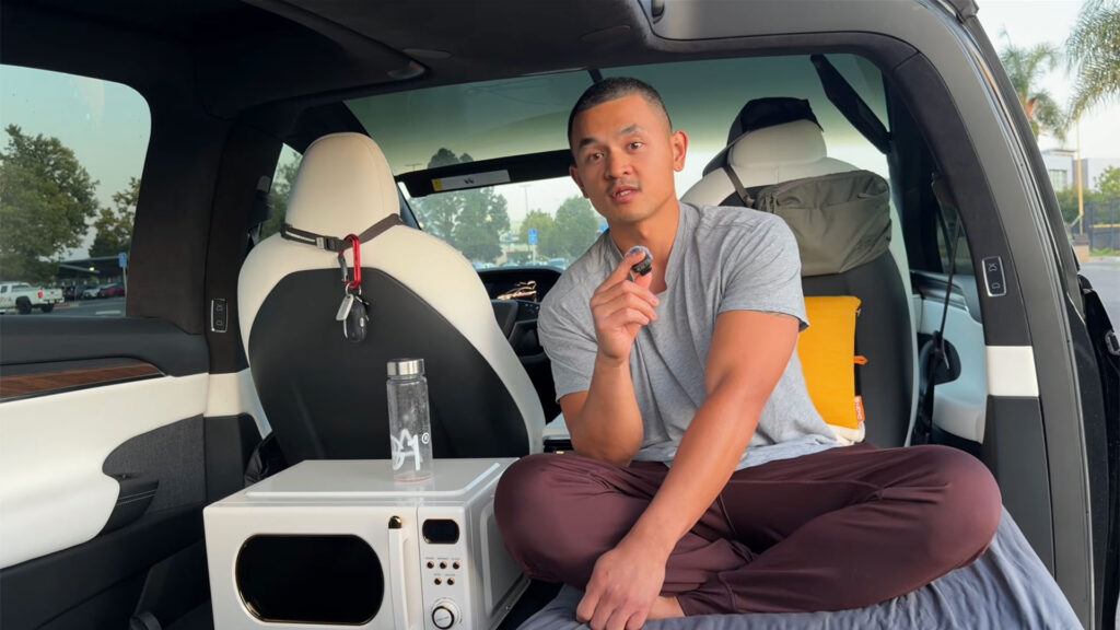 A guy living in his Tesla rent free