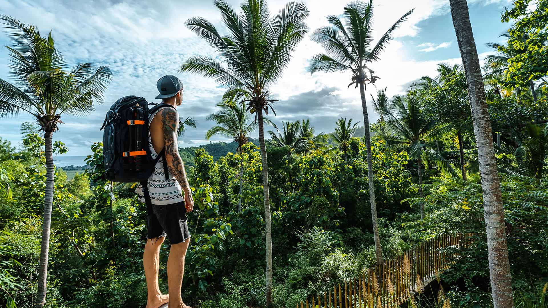 Man with a backpack in the jungle.
