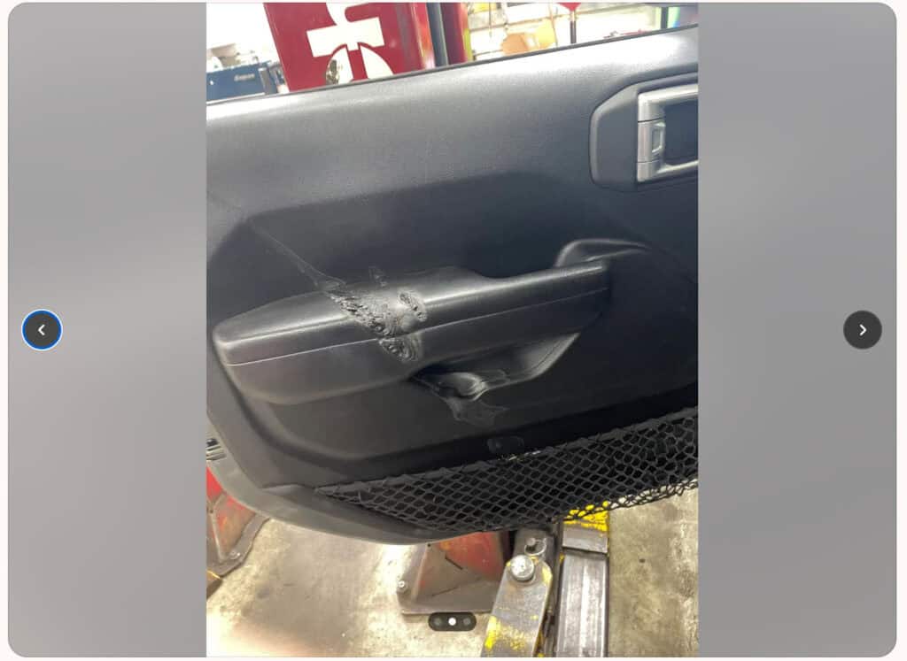 Melted interior of a Jeep.